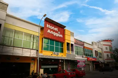 a hotel amazon sign on the side of a building at Anggun Hotel in Seri Iskandar