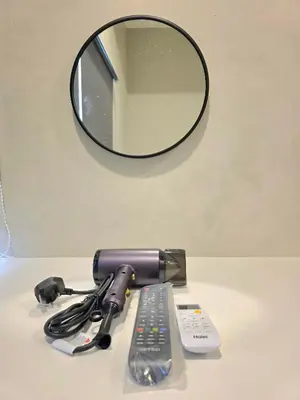 a hair dryer and a mirror on a table at Room at Macalister nearto LohGuanLye Specialists in George Town