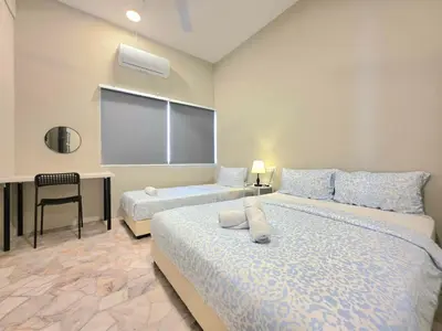 a bedroom with two beds and a projection screen at Room at Macalister nearto LohGuanLye Specialists in George Town