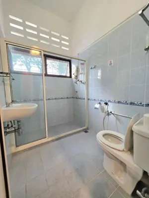 a bathroom with a shower and a toilet and a sink at Room at Macalister nearto LohGuanLye Specialists in George Town