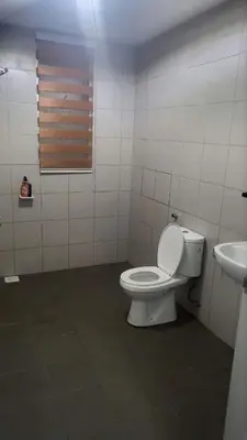 a bathroom with a toilet and a sink at Homestay PPAM Dalur Apartment Presint 18,Putrajaya in Gua Sai