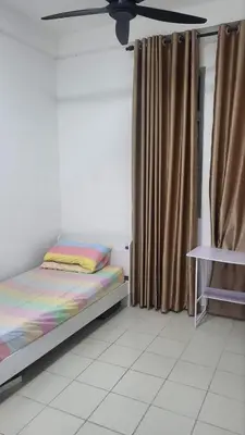 a bedroom with a bed and a ceiling fan at Homestay PPAM Dalur Apartment Presint 18,Putrajaya in Gua Sai