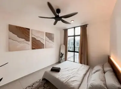 a bedroom with a ceiling fan and a bed at Casa Home Homestay Lunas in Lunas