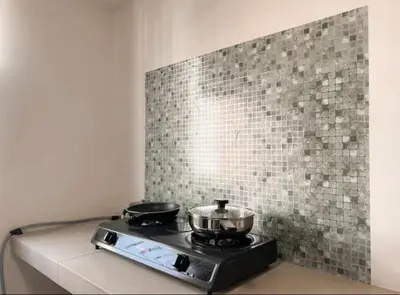 a stove with two pots and pans on it at Casa Home Homestay Lunas in Lunas
