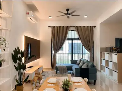 a living room with a blue couch and a table at Casa Home Homestay Lunas in Lunas
