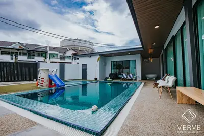 a swimming pool with a slide in a house at Ipoh 55 Private Pool By Verve 26PAX in Ipoh