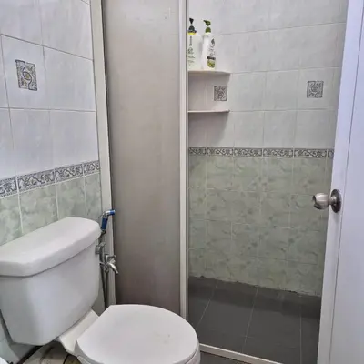 a small bathroom with a toilet and a shower at Setia Arena Penang, Queensbay, Airport, Bridge, Wetmarket, Nasi Kandar in Bayan Lepas