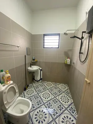 a bathroom with a toilet and a sink at Cozy Homestay, Tasek Idaman Town, Batu Gajah in Batu Gajah
