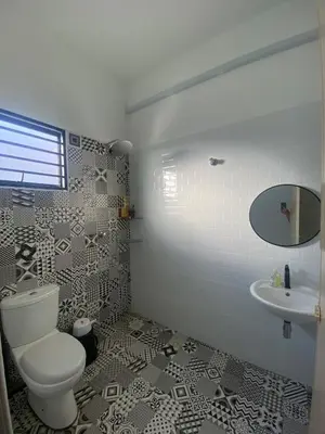 a bathroom with a toilet and a sink at Cozy Homestay, Tasek Idaman Town, Batu Gajah in Batu Gajah