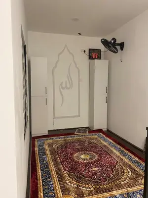 a room with a rug on the floor and a wall at Cozy Homestay, Tasek Idaman Town, Batu Gajah in Batu Gajah