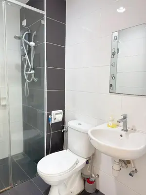a bathroom with a toilet and a sink at Heart of Ipoh 2BR 6pp in Ipoh