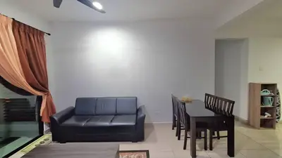 a living room with a couch and a table at A well-kept unit with four bedrooms and ensuite bathrooms in Kampar