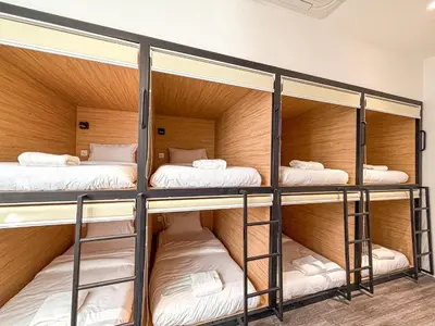 a room with three bunk beds in it at Love Linn in George Town