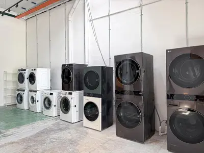 a group of washing and drying machines in a room at Love Linn in George Town