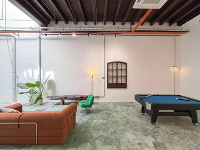a living room with a pool table in it at Love Linn in George Town