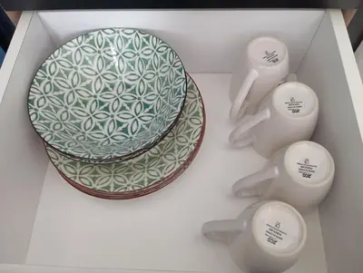 a white box with a plate and two spoons at Radif Homestay Seri Iskandar with Balcony#2 in Kampong Bota Road