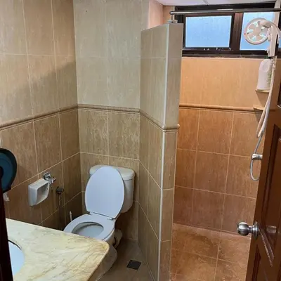 a small bathroom with a toilet and a sink at Sri Sayang Batu Ferringhi 4 Bed in Batu Ferringhi