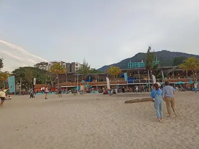 a group of people standing on a beach at Sri Sayang Batu Ferringhi 4 Bed in Batu Ferringhi