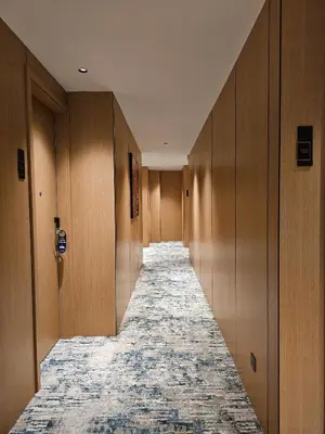 a hallway of a hotel with a carpeted corridor at The Green Hall in George Town