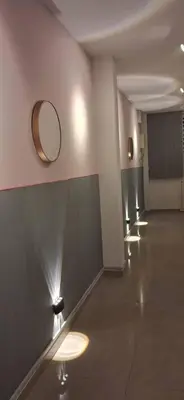 a hallway with a row of lights on the wall at Cozy Nook in George Town