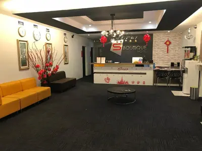 a lobby of a store with a couch and a counter at S Boutique Hotel in Ipoh