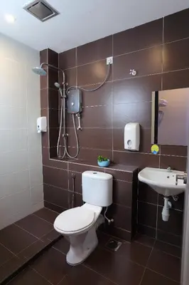 a bathroom with a toilet and a sink at S Boutique Hotel in Ipoh