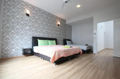 a bedroom with a bed and a wall at Shamrock Beach Villas 9 Seaview in George Town
