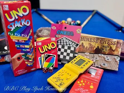 a table with snacks and a toy car on it at BBC Play Ipoh Homestay in Ipoh