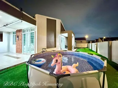 a toy horse in a pool in a house at BBC Play Ipoh Homestay in Ipoh