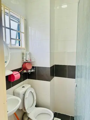 a bathroom with a toilet and a sink at AYAAN LAVENDER Homestay with PS4 Gaming and Netflix at Tanah Rata Cameron Highland in Tanah Rata