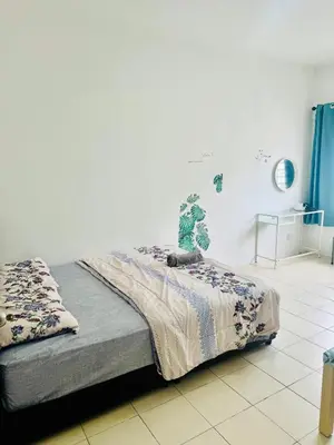 a bedroom with a bed with a blanket on it at AYAAN LAVENDER Homestay with PS4 Gaming and Netflix at Tanah Rata Cameron Highland in Tanah Rata