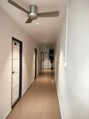 an empty hallway with a ceiling fan in a house at MR Homestay HotelStyle Room Hutan Melintang in Hutan Melintang