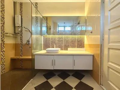 a bathroom with a sink and a shower and a mirror at Raja Uda Family Haven 4BR 10 Pax in Butterworth