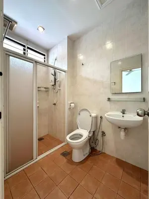 a bathroom with a toilet and a shower and a sink at Raja Uda Family Haven 4BR 10 Pax in Butterworth