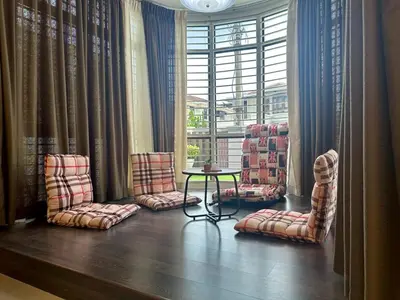 a room with chairs and a table and a window at Raja Uda Family Haven 4BR 10 Pax in Butterworth