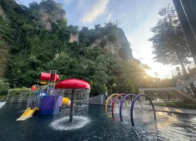 a water park with a water slide in the water at 3 Bed Rooms Cozy Unit The Cove in Ipoh