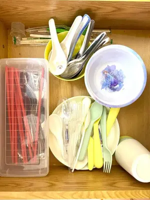 a drawer filled with utensils and plates and utensils at Simee Cozy Homestay ,Simee, Ipoh Town in Ipoh