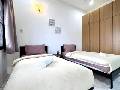 a room with two beds in a room at Simee Cozy Homestay ,Simee, Ipoh Town in Ipoh