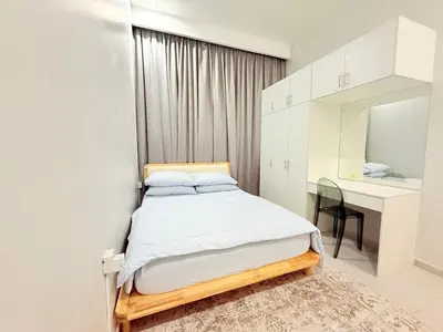 a small bedroom with a bed and a desk at Adam Luxe Homestay Tapah in Tapah
