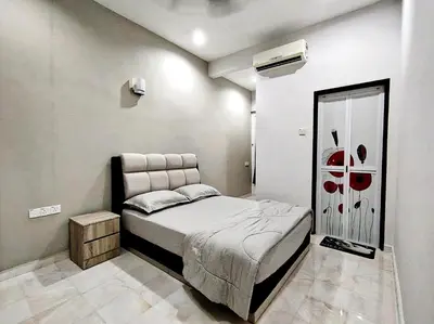 a bedroom with a bed in a room at Ipoh FamilyHub by One Life Four Season Guesthouse in Ipoh