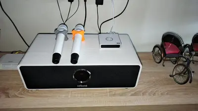 a laptop computer with a pair of scissors in it at Lapangan Sentosa Homestay Ipoh in Ipoh