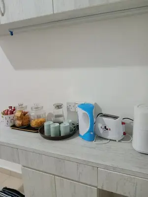 a counter top with various appliances on it at Ereens penthouse Cameron highland in Brinchang