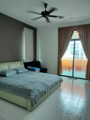 a bedroom with a bed and a ceiling fan at Woon homestay 2 in Balik Pulau