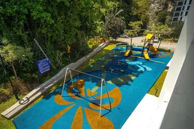 an aerial view of an empty playground in a park at Ipoh The Cove Hillside Premier Suites By LUX SUITE in Ipoh