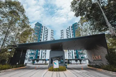 a building with a sign in front of it at Ipoh The Cove Hillside Premier Suites By LUX SUITE in Ipoh