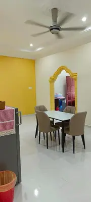 a dining room with a table and chairs at ANAS Inn Homestay Balik Pulau, Penang in Balik Pulau