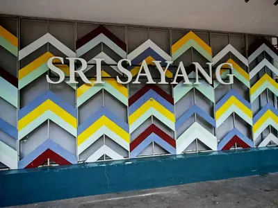a wall with a sign that says santa ana on it at Sri Sayang Homestay 2 in Batu Ferringhi