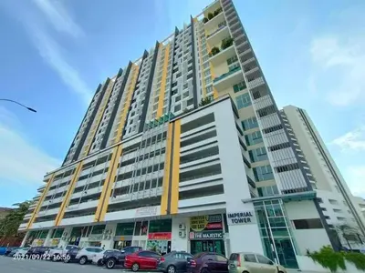 a large building with cars parked in front of it at Ipoh Poolside 7th Floor 3BR Homestay in Ipoh