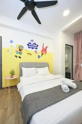 a bedroom with a bed with a ceiling fan at SpongeBob Fun Family Homestay In Brinchang Cameron Highland Clover Home 7-02 in Brinchang