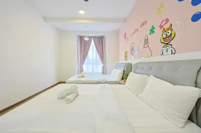 a bedroom with two beds and a wall with a mural at SpongeBob Fun Family Homestay In Brinchang Cameron Highland Clover Home 7-02 in Brinchang